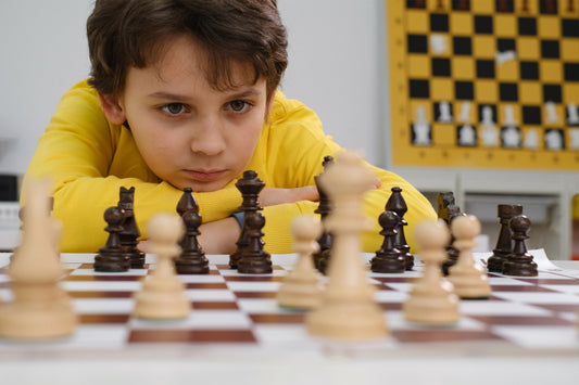 A boy playing chess